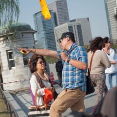 Guide with flag