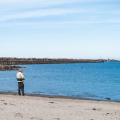 Old man in front of the sea