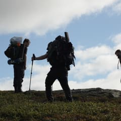 Almost on the top of the mountain with backpacks