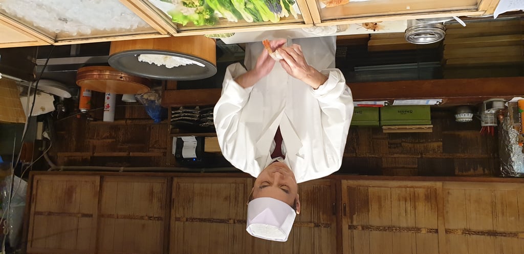 Sushi chef at Tsukiji Itadori Bekkan - Tokyo Japan 2020
