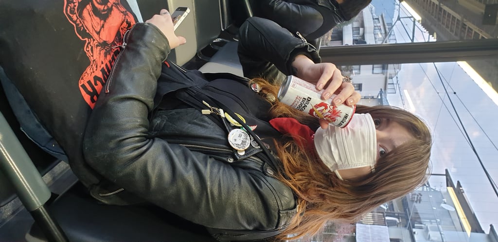 Drinking energy drink on train - Kyoto Japan 2020