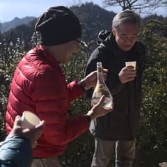 Japanese men drinking sake at top of Miyajima Japan 2020