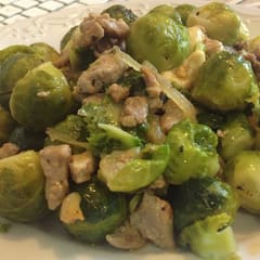 Delicious sprouts in butter with pork and onions.